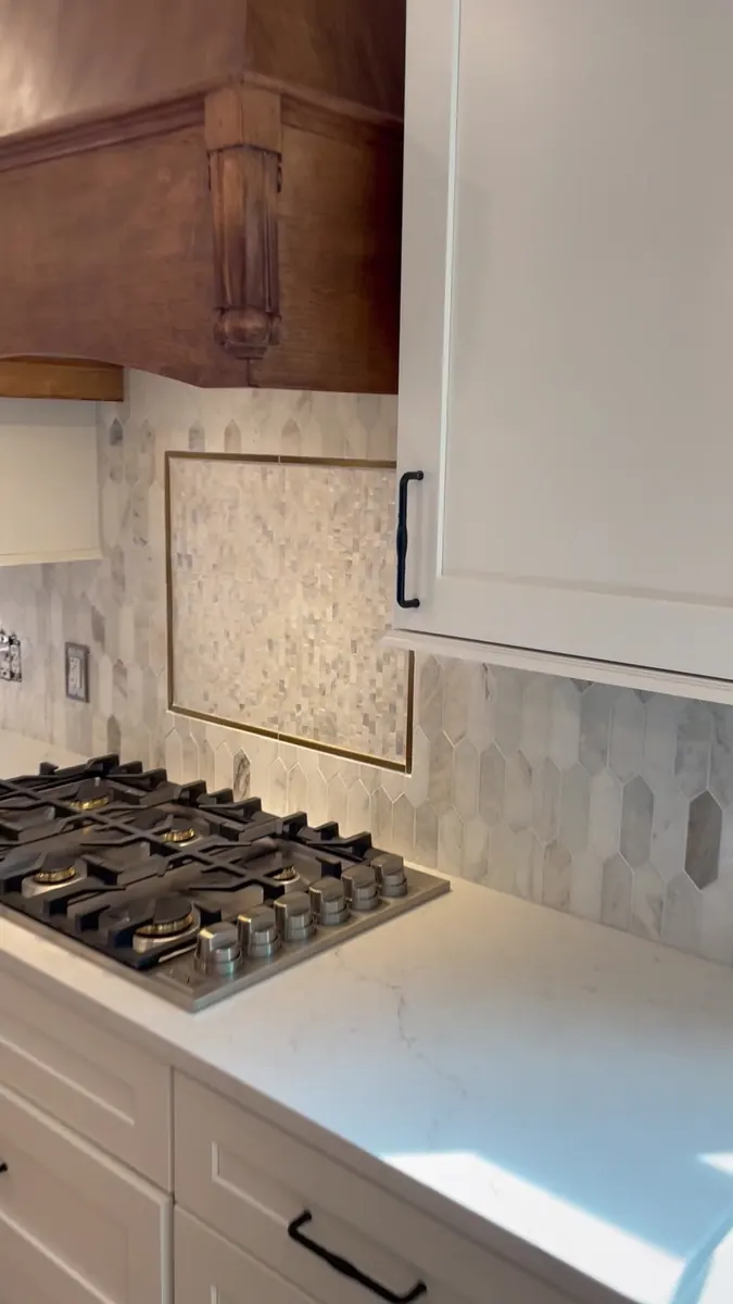 Range hood detail with marble tile